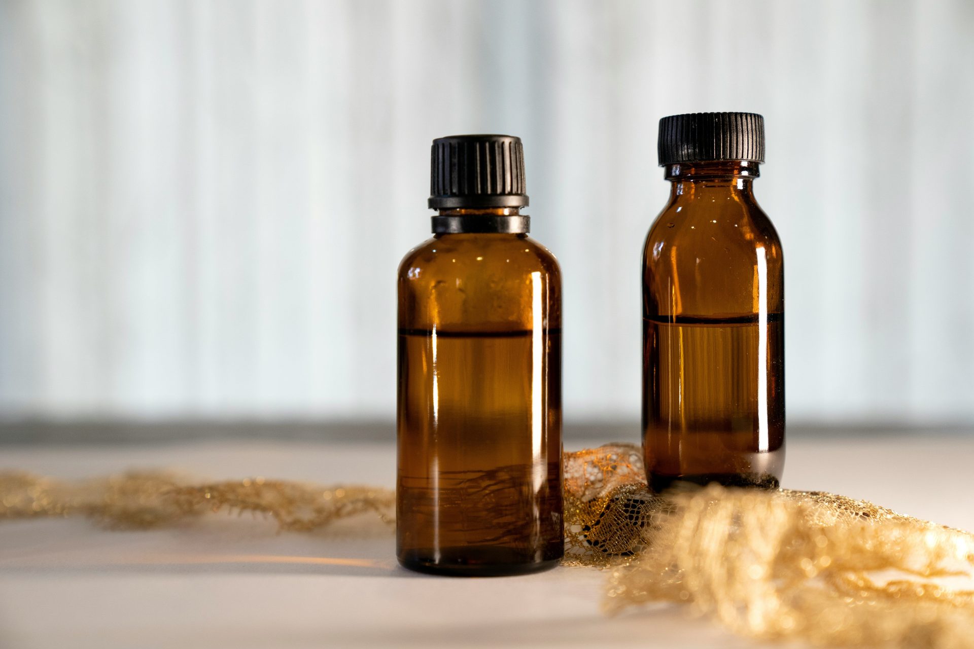 a couple of brown bottles sitting on top of a table
